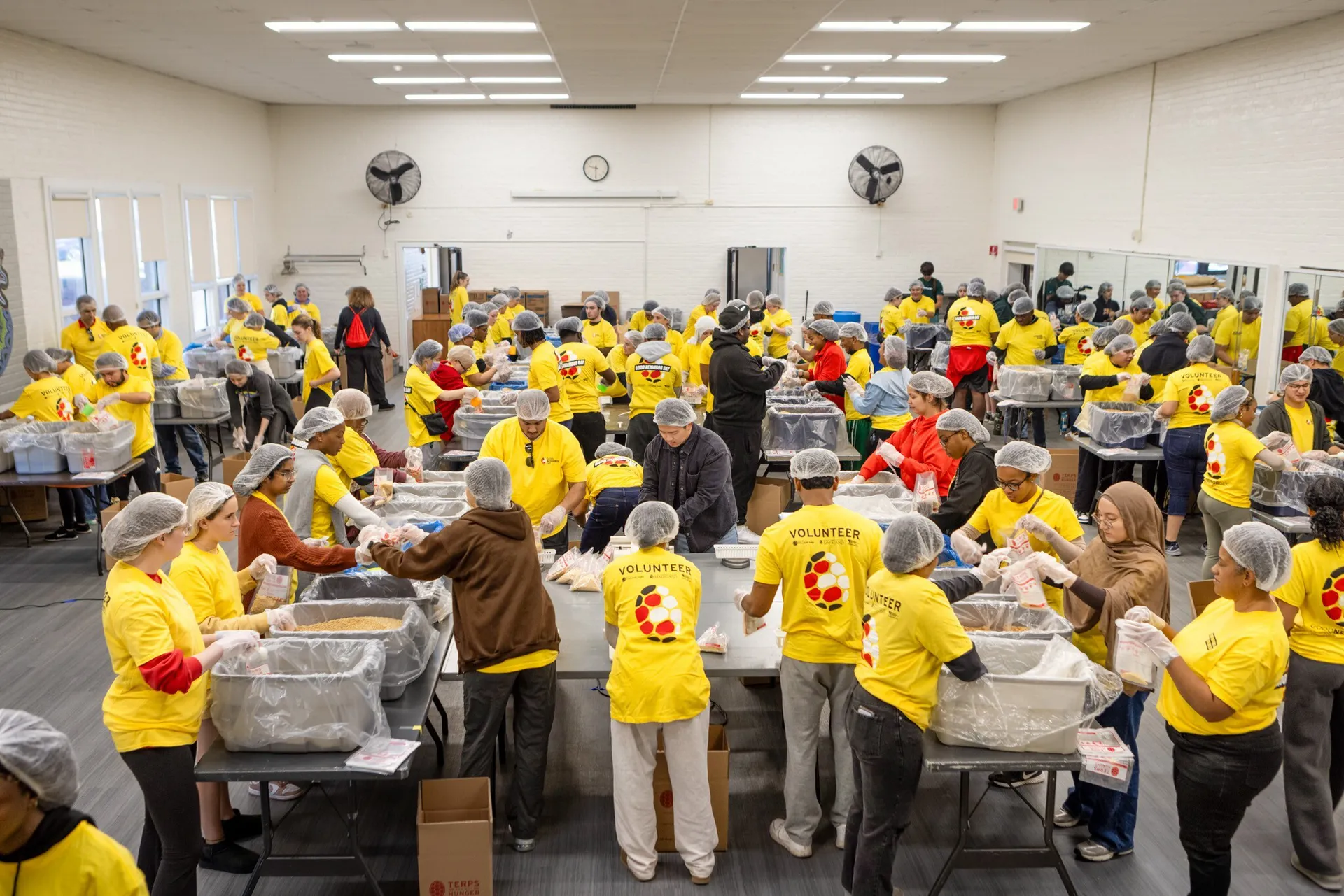 Volunteers packing food for Good Neighbor Day