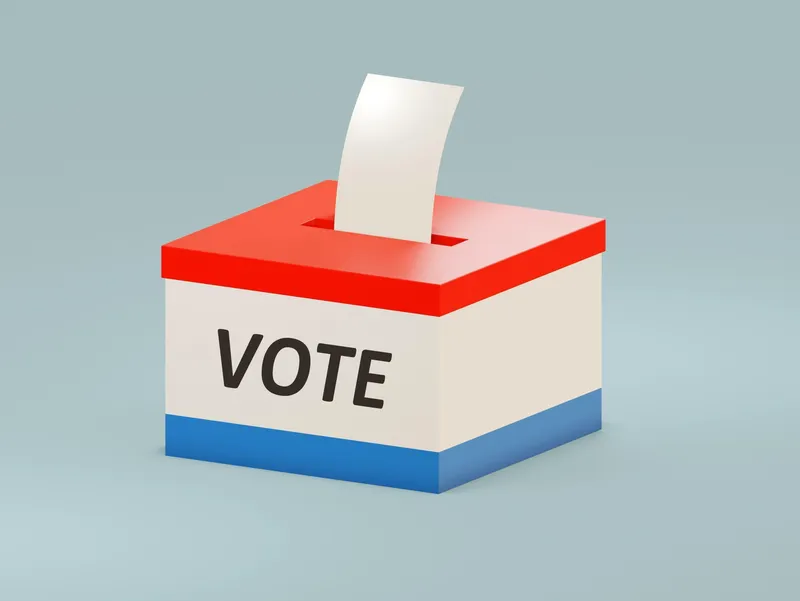 red, white, and blue voting box with a ballot