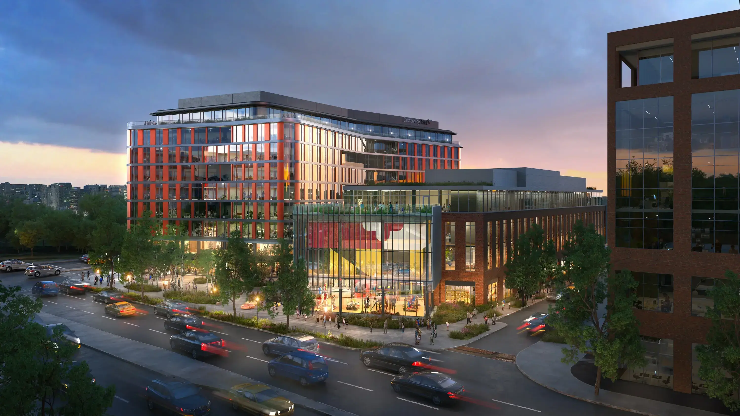 Discovery Point at lit up at dusk with warm lighting spilling out onto communal areas