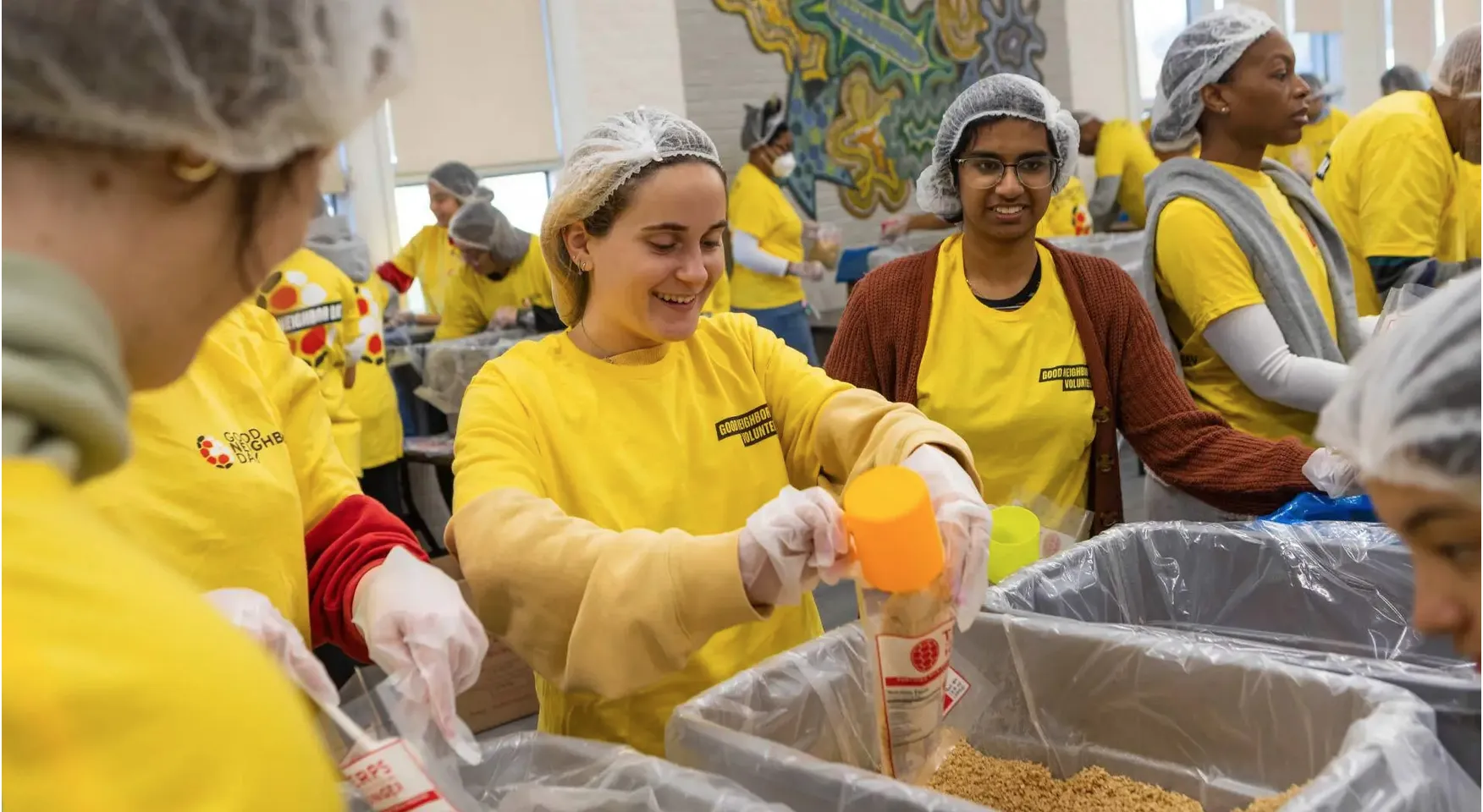 Students assemble meal kits.