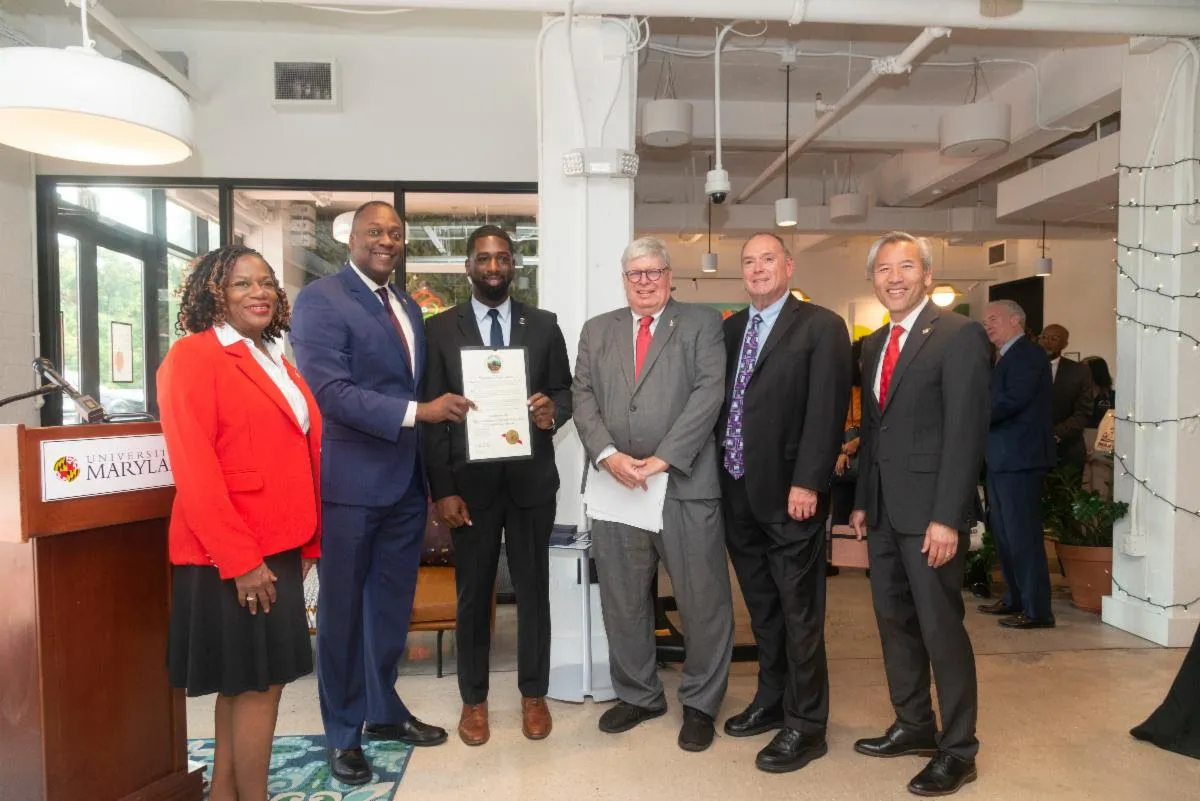 Notable attendees posing together celebrating first anniversary of the Maryland Business Opportunity Center (MBOC).
