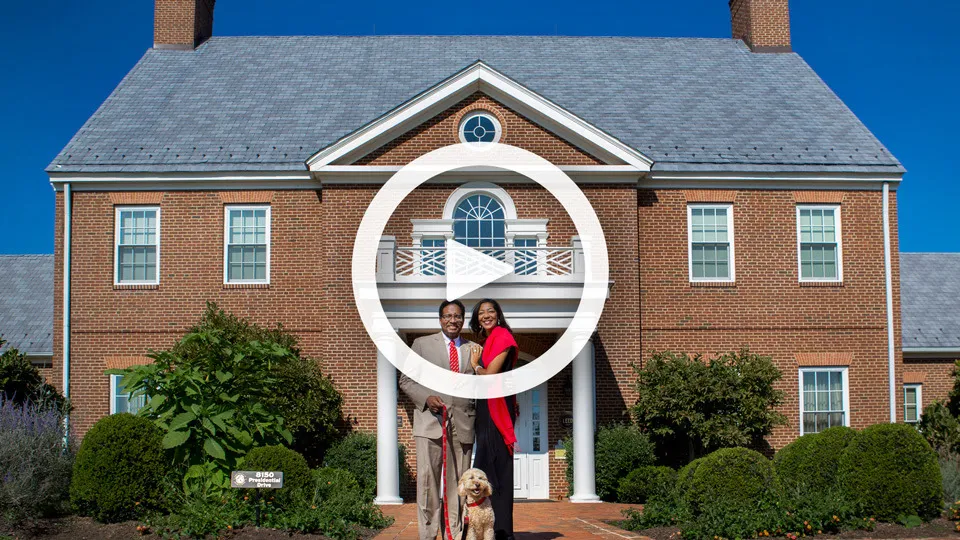Holiday video still of Dr. Pines with his wife and dog