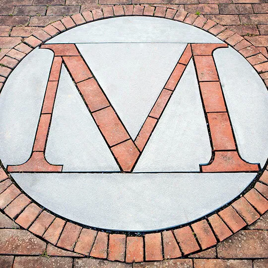 M logo laid in brick