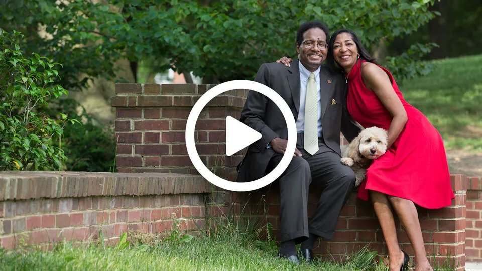 Screenshot of video with President Pines, his wife, and dog